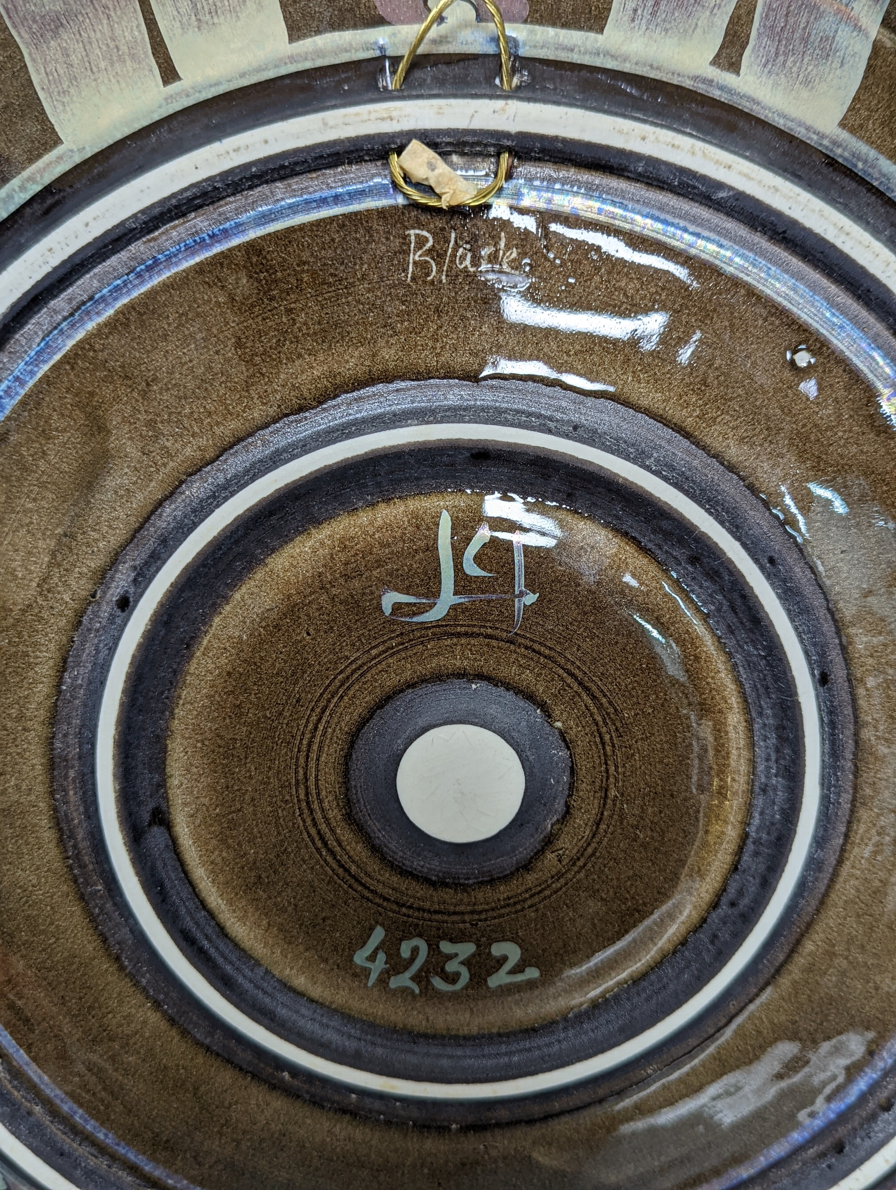 Jonathan Chiswell-Jones. A pomegranate pattern reduction fired lustre charger, numbered 4232, diameter 44cm